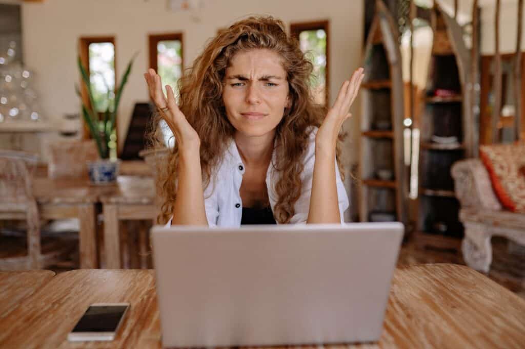 A frustrated lady working with the slow internet