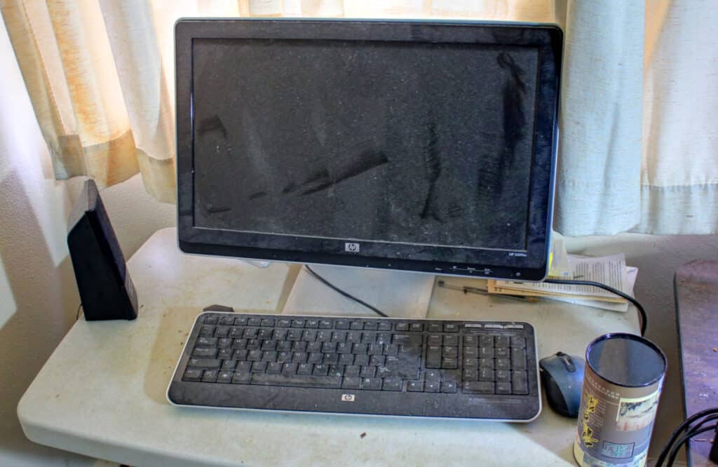 A dusty Pc and a Keyboard