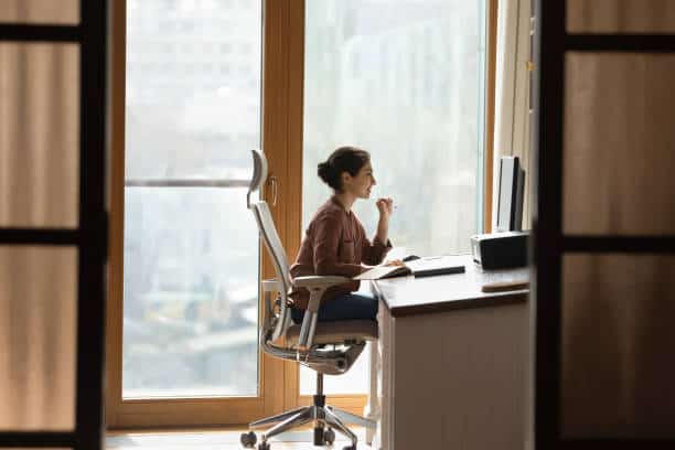 A woman at office maintaining an ergonomic position