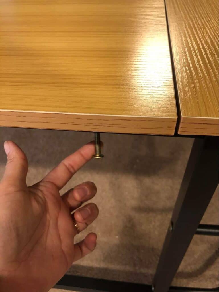 loose screw on desk