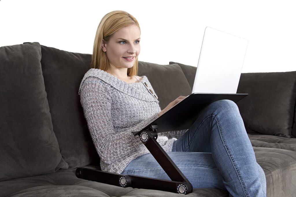 Using a laptop stand sitting on a couch