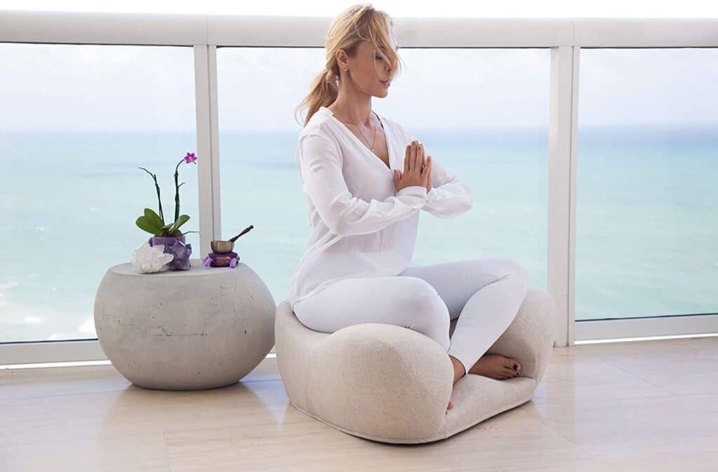 A women sitting in a Alexa Meditation chair